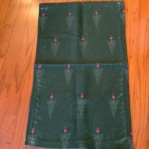 GREEN AREA RUG with design of red vase/tree decor.  21.5" X 34.5"